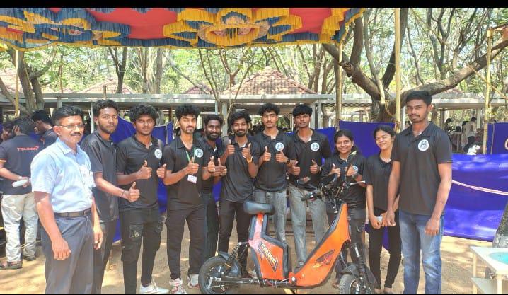Team Sparks members with their electric two-wheeler